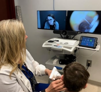 Primary care female doctor with patient