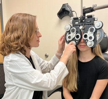 Female eye doctor examining patient